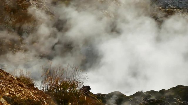 Slow Motion Video close up of smoke in Goshougake Onsen hotspring in autumn season Akita Prefecture Japan.