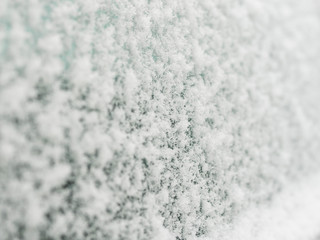 car side window covered in snow prepare your car for winter time