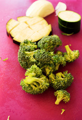 Broccoli, eggplant, fennel cut on kitchen desk.