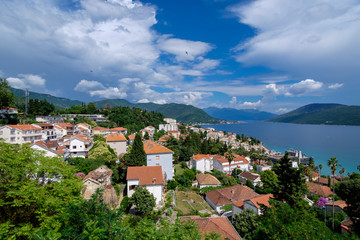 Fototapeta na wymiar tiled roofs on the background of the mountains in Montenegro