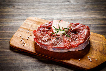 Raw beefseak on cutting board