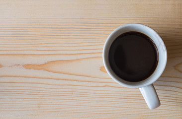 coffee cup on wooden table background