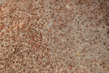 Deep rust stained smudge dots sheet metal uncommon texture.