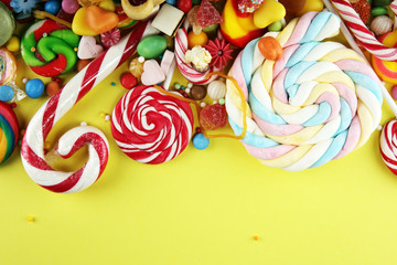 candies with jelly and sugar. colorful array of different childs sweets and treats.