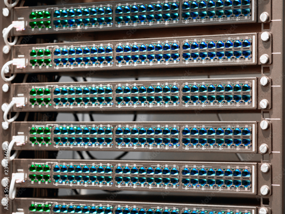 Poster Network routers of ISP. Many wires connect to the network interfaces of powerful Internet servers. Racks with computer equipment in the server room data center.