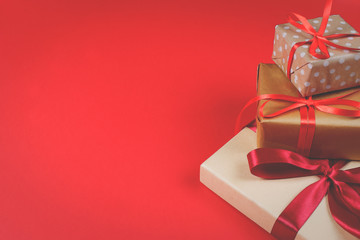 Three presents on red background.