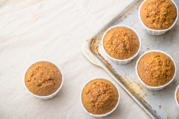 group of delicious muffins on a light background