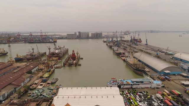 aerial view cargo and passenger seaport with ships and crane Tanjung Perak, surabaya, indonesia. docks for the repair and parking of ships, cargo port and container terminal. ship in industrial port