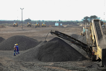 Large piles of processed Manganese ore rock