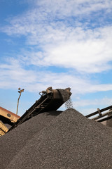 Large piles of processed Manganese ore rock