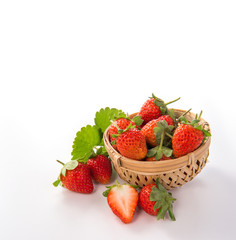 A bowl of beautiful strawberries isolated on white background with clipping path, close up, macro.