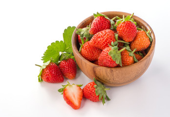 A bowl of beautiful strawberries isolated on white background with clipping path, close up, macro.
