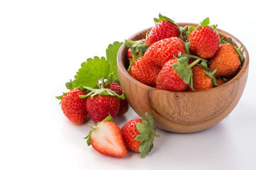 A bowl of beautiful strawberries isolated on white background with clipping path, close up, macro.