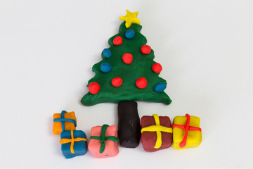 step by step making pine tree and gifts for Christmas with play dough for children's activity. school,nursery or kindergarten lesson plasticine concept.