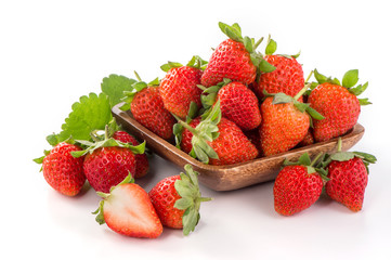 A bowl of beautiful strawberries isolated on white background with clipping path, close up, macro.