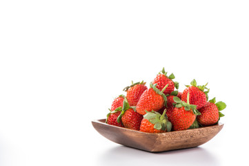 A bowl of beautiful strawberries isolated on white background with clipping path, close up, macro.