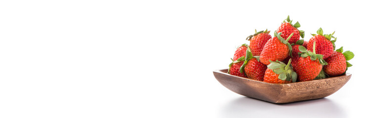 A bowl of beautiful strawberries isolated on white background with clipping path, close up, macro.