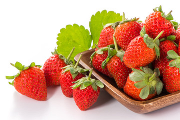 A bowl of beautiful strawberries isolated on white background with clipping path, close up, macro.