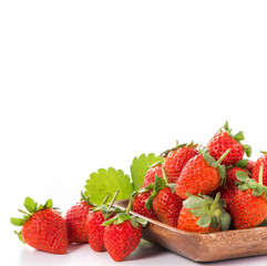 A bowl of beautiful strawberries isolated on white background with clipping path, close up, macro.