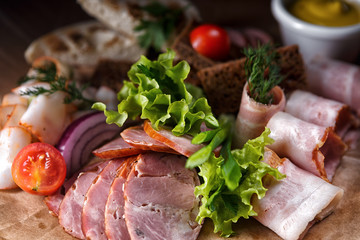 Meat platter sliced with herbs
