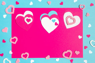 Valentine s Day greeting card. 14th of february. Happy Valentines Day Lettering with cut paper hearts on blue pink background