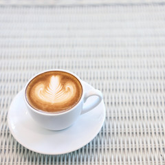 heart shape latte art of hot coffee drink tasty on white table