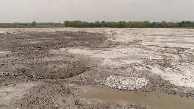 Mud volcano bledug kuwu. aerial view volcanic plateau with geothermal activity and geysers, Indonesia java. aerial view volcanic landscape