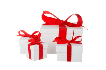 Stack of presents white gifts ribbon red bow isolated on white background