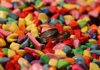 colorful stones and wedding rings rings