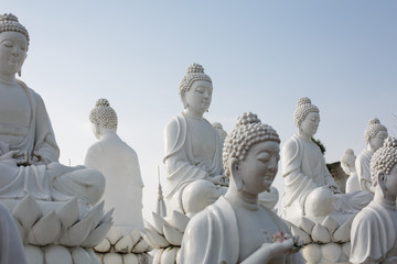 The white statue of Buddha was illuminated by the sun - 239152696
