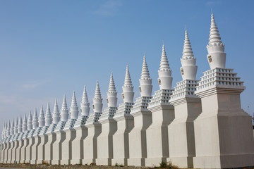 The beautiful white pagoda is under the blue sky - 239153042