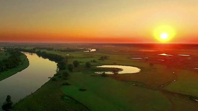 aerial view of river at sunrise, fly over morning mist on the river, Very high view of the river at sunrise, Aerial view of mystical river at sunrise with fog, sun above the river aerial