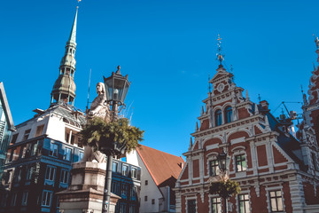 View on Roland Statue, The Blackheads House and St Peter church. Old City center of Riga, The Town Hall Square. October 25, 2018.