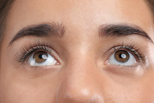 Young woman with beautiful eyelashes, closeup view