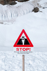 Warning ice ground breaking signs on Jungfraujoch, Switzerland