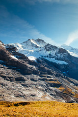 Panoramic view of rock cliff, Jungfrau peak view from Kleine Scheidegg station, Switzerland