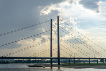 Bridge on river and dramatic sky