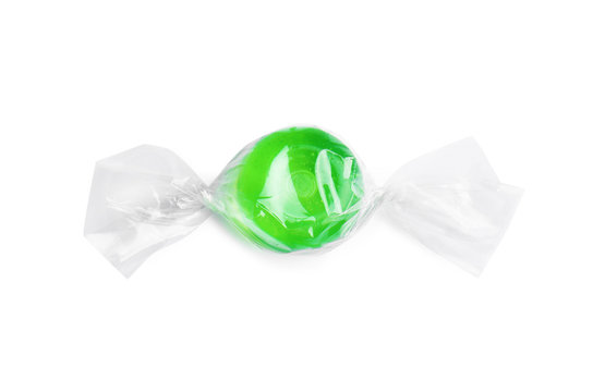 Wrapped delicious colorful candy on white background