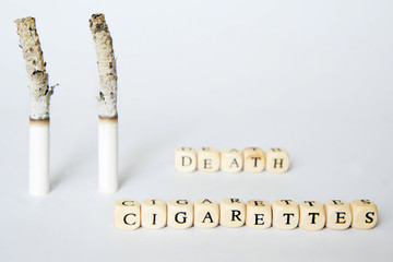 Symbolic picture of death due to cigarette smoking. Inscriptions about cigarettes and death