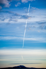 Trace of the plane over the mountain