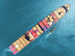 Aerial top view container ship at sea port for import export, shipping or transportation concept...