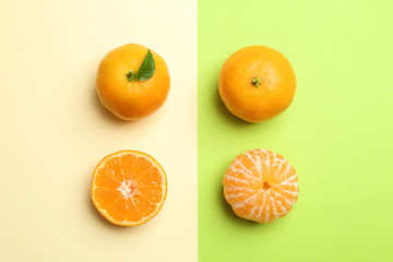 Flat lay composition with fresh juicy tangerines on color background