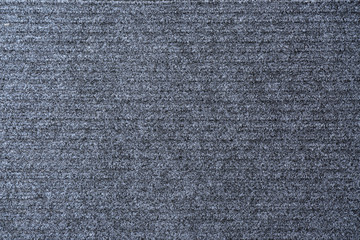 Modern grey doormat as background, top view