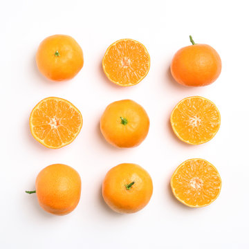 Composition with juicy tangerines on white background, top view