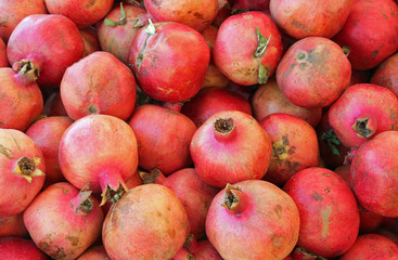 Fototapeta na wymiar red ripe pomegranate in autumn