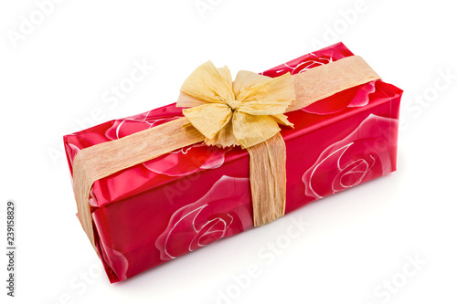 Gift Box Wred In Red Rose Cellophane Decorated With Ecru Raffia Gift Box Wred In Red Rose Cellophane Decorated With Ecru Raffia Ribbon And Bow Isolated On The White Background