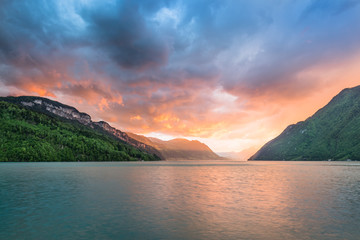 The sun sets over the mountains. The sky in bright sunset colors.