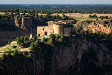 Fototapeta na wymiar Natural Park Sickles of the Duraton River. Landscape and cliffs. Hermitage of San Frutos, ancient temple. Segovia, Spain