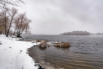 View of the Dnieper river during a cold and snowy winter day.