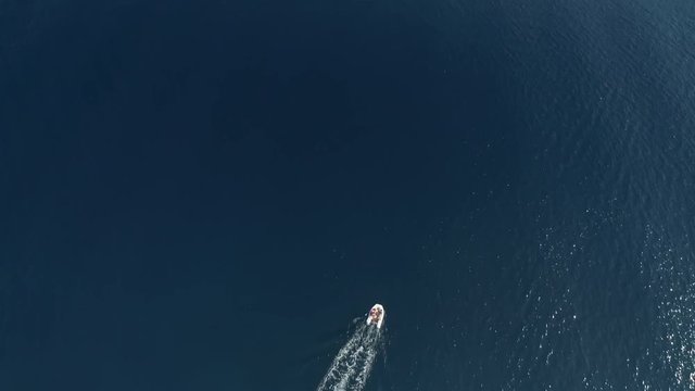 Aerial view of boat faraway in the mediterranean sea, Vathi, Greece.